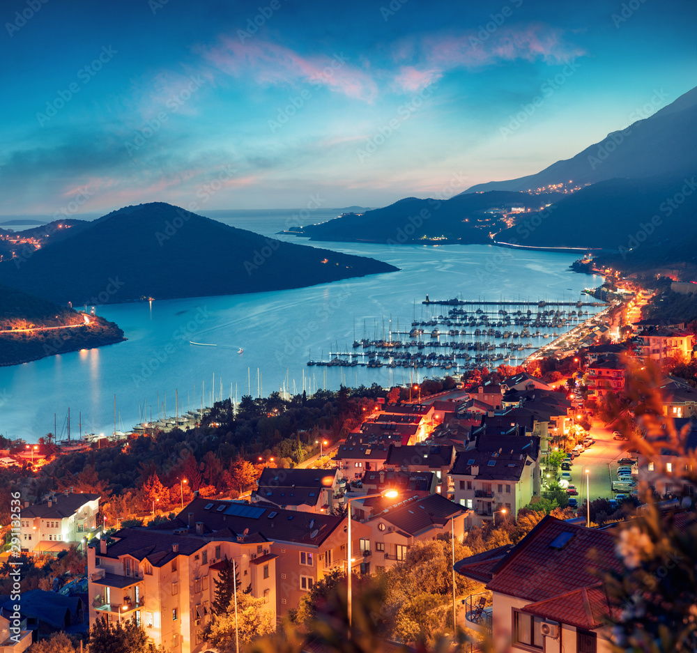 View from the bird's eye of the Kas city, district of Antalya Province of Turkey, Asia. Colorful spring sunset in small Mediterranean yachting and tourist town. Traveling concept background.