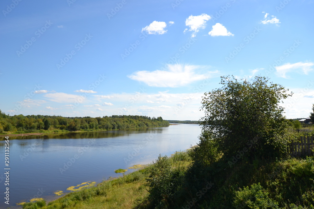 Beautiful northern summer landscape: Colva river flow beside Pokcha town