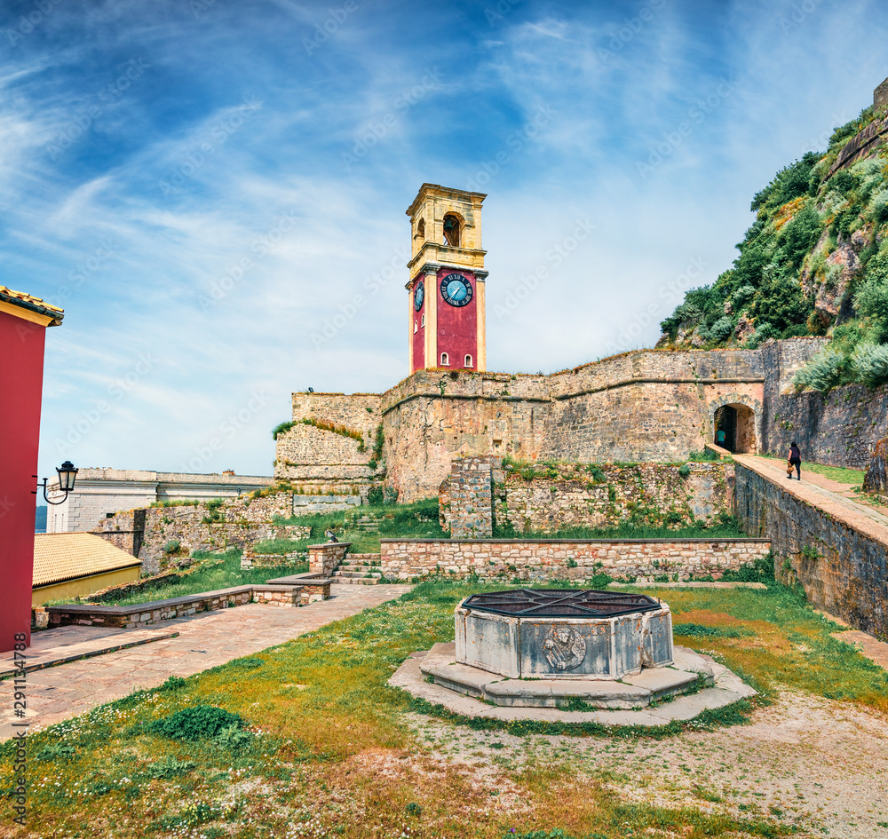 Splendid spring view of Old Venetian Fortress (Paleo Enetiko Frourio) with Clock Tower. Captivating morning cityscape of Corfu Town, capital of the Greek island of Corfu, Greece, Europe.