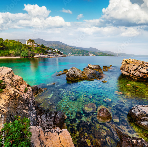 Fototapeta Naklejka Na Ścianę i Meble -  Colorful spring view of Kanoni Beach. Marvelous morning seascape of Ionian Sea. Great outdoor scene of Kassiopi village and resort, Corfu island, Greece, Europe. Beauty of nature concept background.