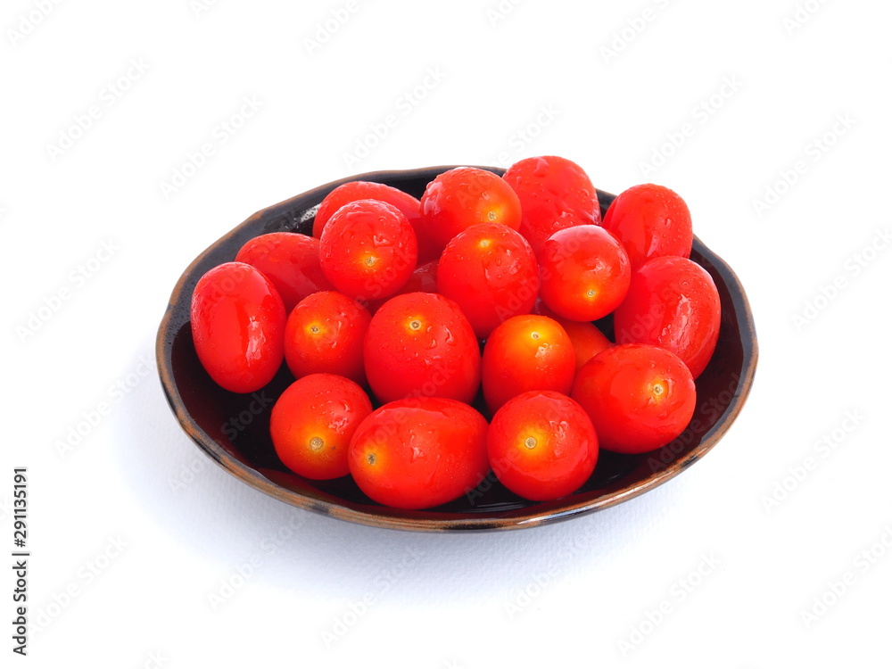 tomato in brown plate on white background. tomato in brown plate on white background.