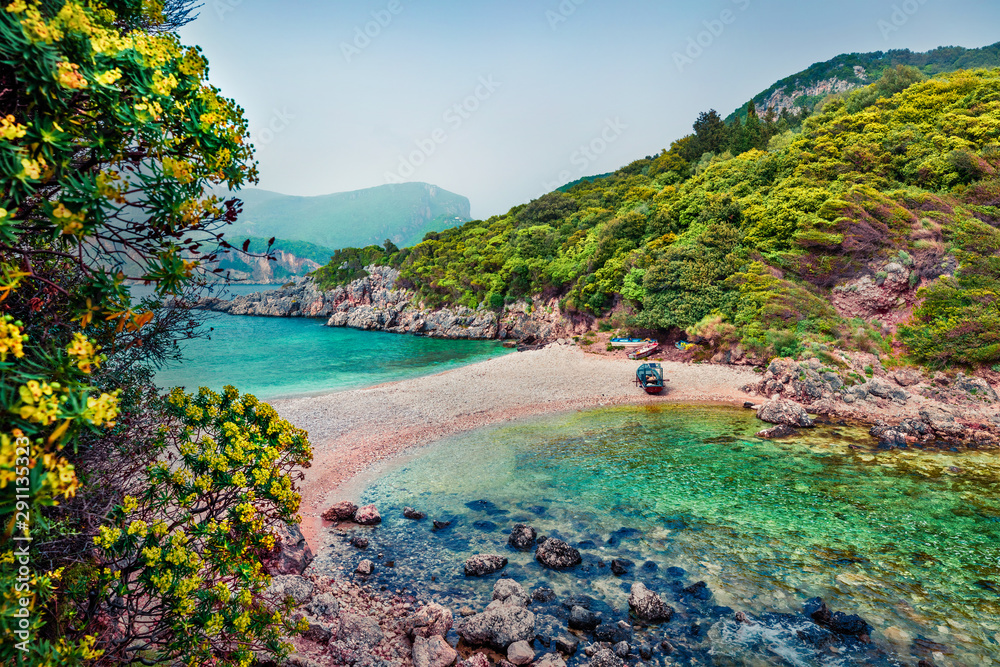 Attractive spring view of Limni Beach Glyko. Fabulous morning seascape of Ionian Sea. Splendid outdoor scene of Corfu island, Greece, Europe. Beauty of nature concept background.