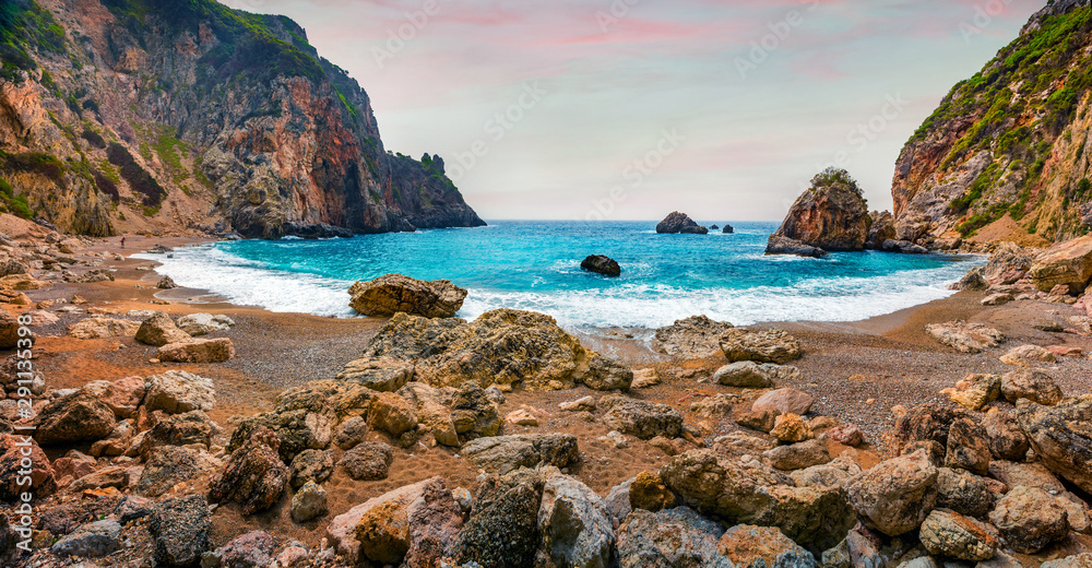 Dramatic spring sunrise of Gyali beach. Picturesque morning seascape of Ionian Sea. Fantastic outdoor scene of Corfu island, Greece, Europe. Beauty of nature concept background.