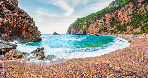 Gorgeous spring view of Gyali beach. Panoramic morning seascape of Ionian Sea. Fantastic outdoor scene of Corfu island, Greece, Europe. Beauty of nature concept background.