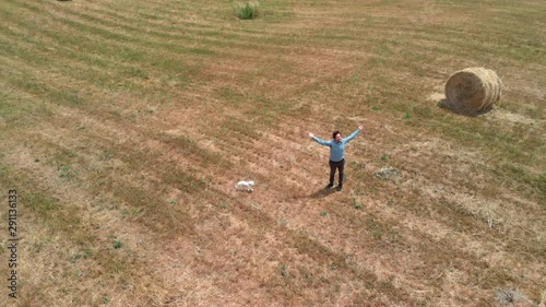 Wallpaper Mural Man full of joy with open arms in corn field drone shot Torontodigital.ca
