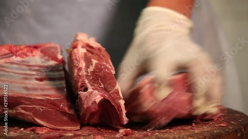 Cutting fresh mutton on wood 