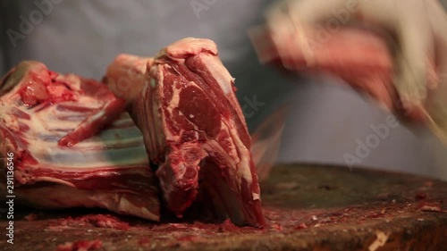 Cutting fresh mutton on wood 