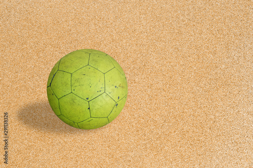 soccer ball on sand background