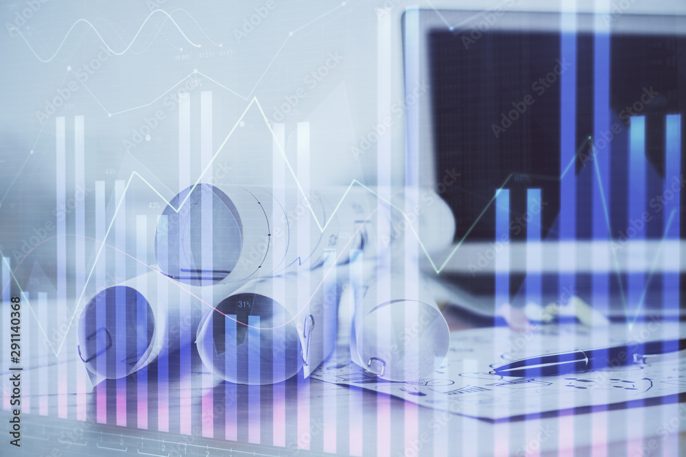 Forex Chart hologram on table with computer background. Multi exposure. Concept of financial markets. Forex Chart hologram on table with computer background. Multi exposure. Concept of financial markets.