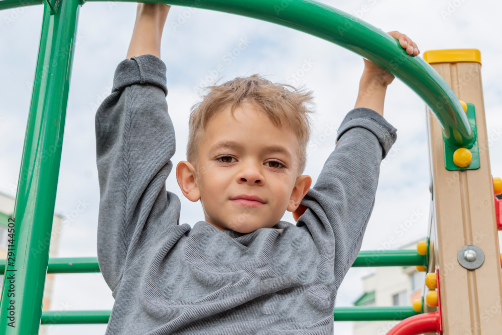 A little boy is engaged in sports equipment A little boy is engaged in sports equipment