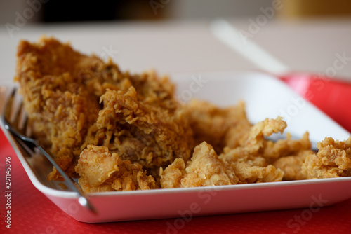 A plate of  delicious fried chickens on the table