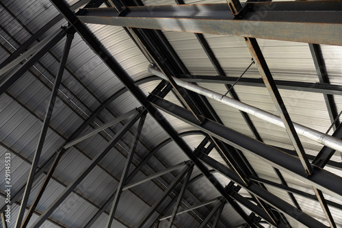 Inside view of metal roof made of metal leaves and beams