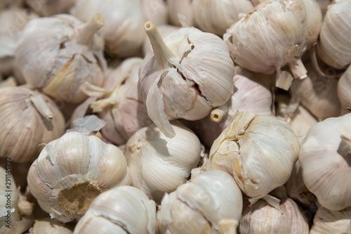 Close-up of garlic bulbs on grocery store shelf
