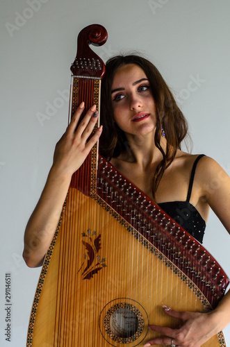 girl woman bandura musical instrument photo