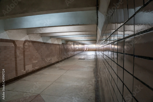 Old empty underpass with light in the end