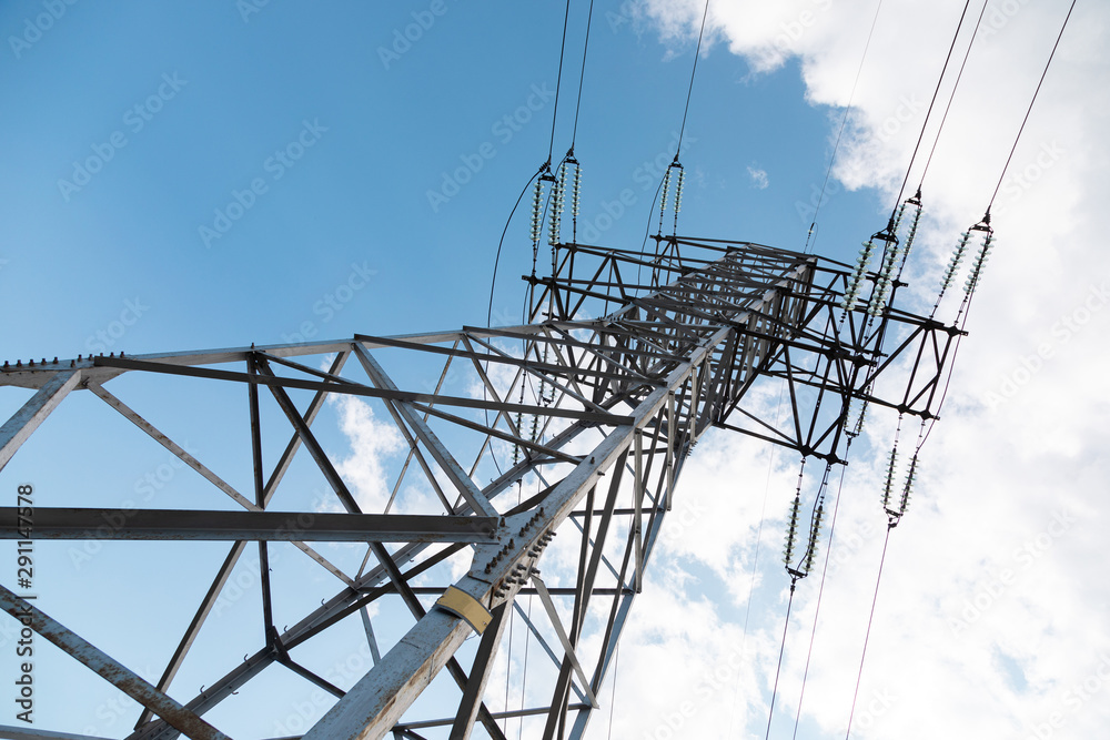 Worm's view of power pylon against clear sky Worm's view of power pylon against clear sky