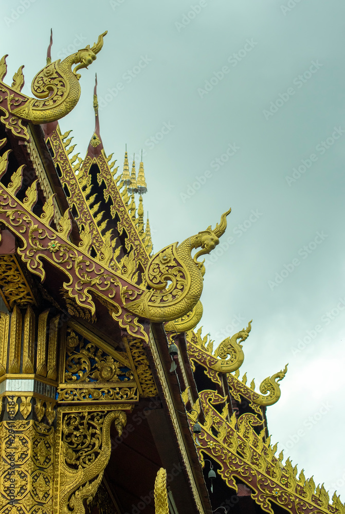 Fototapeta premium Ornate eaves and roof decorations of Wat Saen Muang Ma Luang, Chiang Mai, Thailand