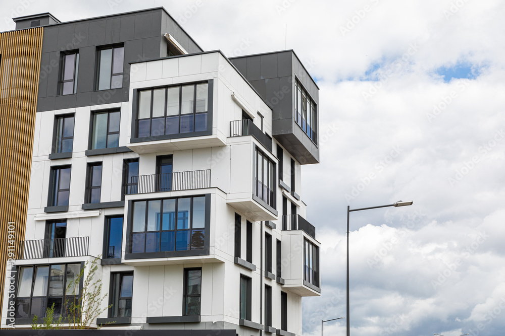 Upper part of dwelling house building against sky