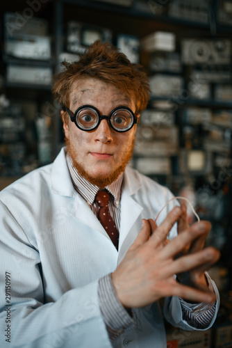Crazy male scientist working in laboratory