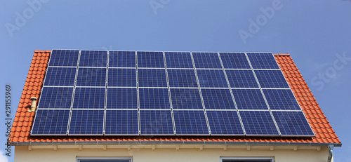 Roof with solar panels (photovoltaics) photo