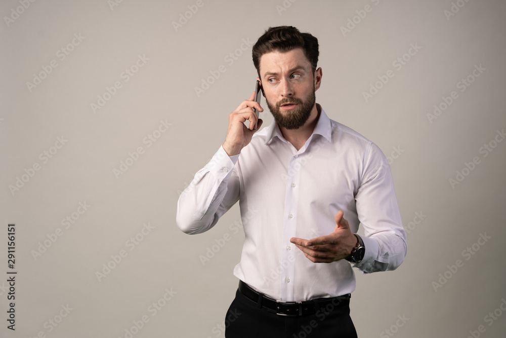 Portrait of cheerful man talking on the phone. Making some arrangements. Doing some serious business staff. Complaining about something Portrait of cheerful man talking on the phone. Making some arrangements. Doing some serious business staff. Complaining about something