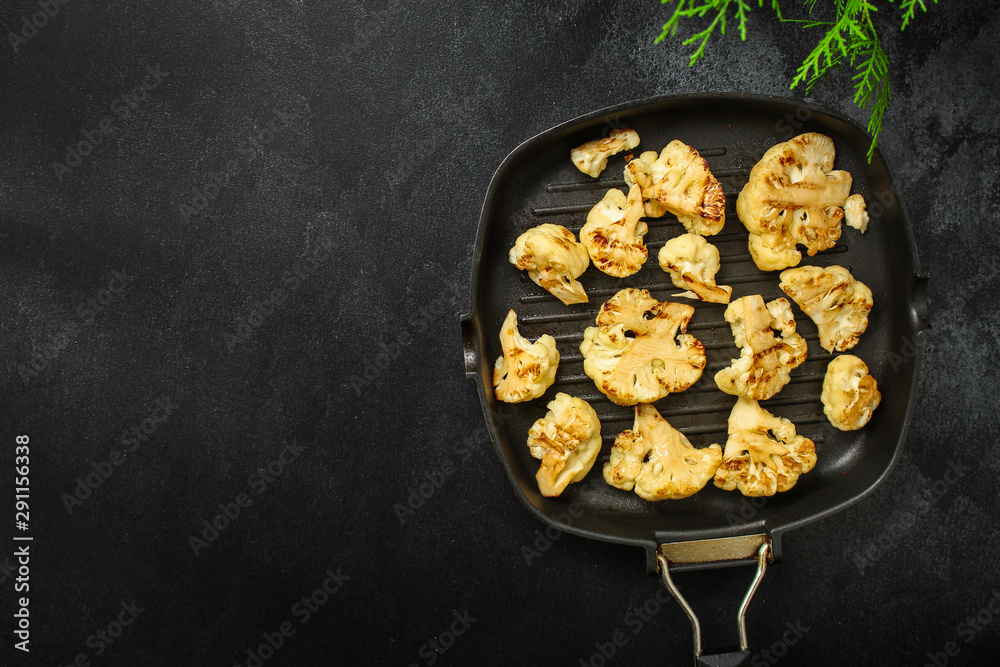cauliflower grilled (fried grill vegetables or snack salad, bruschetta with tomato) menu concept. food background. copy space. Top view