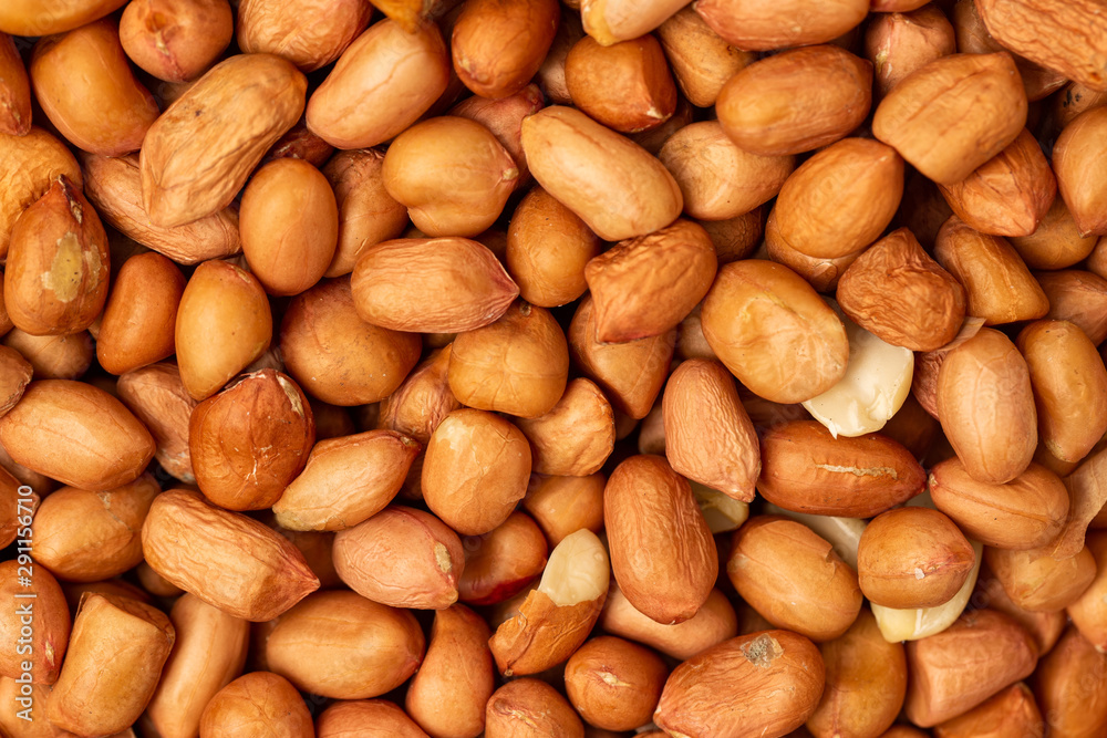 Closeup flatlay image of salted peanuts as a food background. Closeup flatlay image of salted peanuts as a food background.