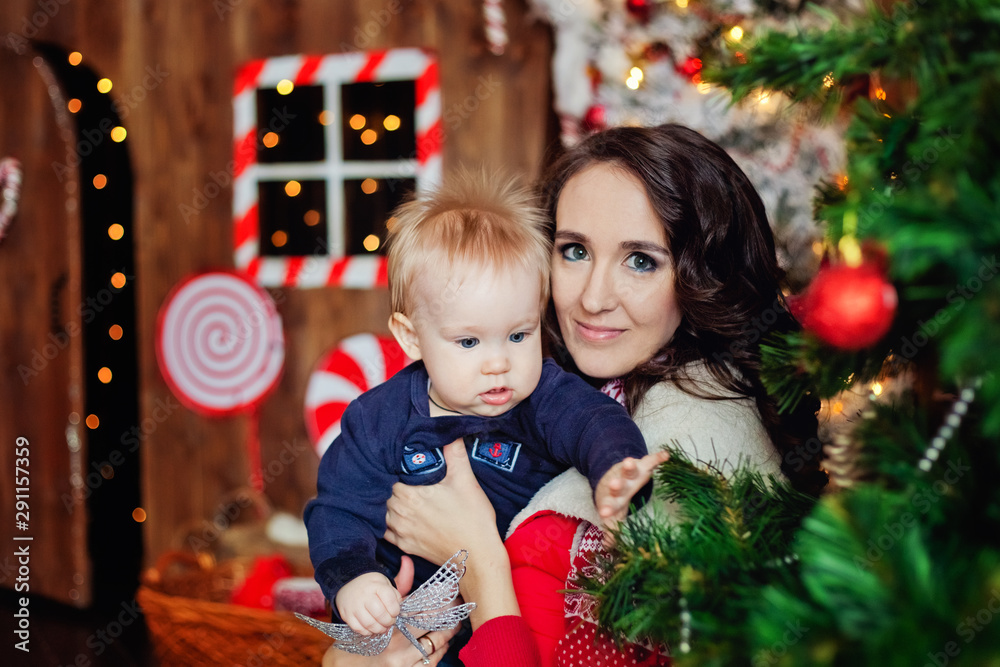 mother and child decorating christmas tree