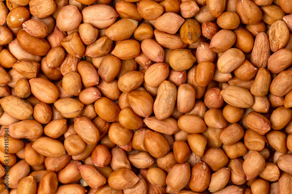 Macro flatlay image of roasted peanuts as a natural food pattern. Macro flatlay image of roasted peanuts as a natural food pattern.
