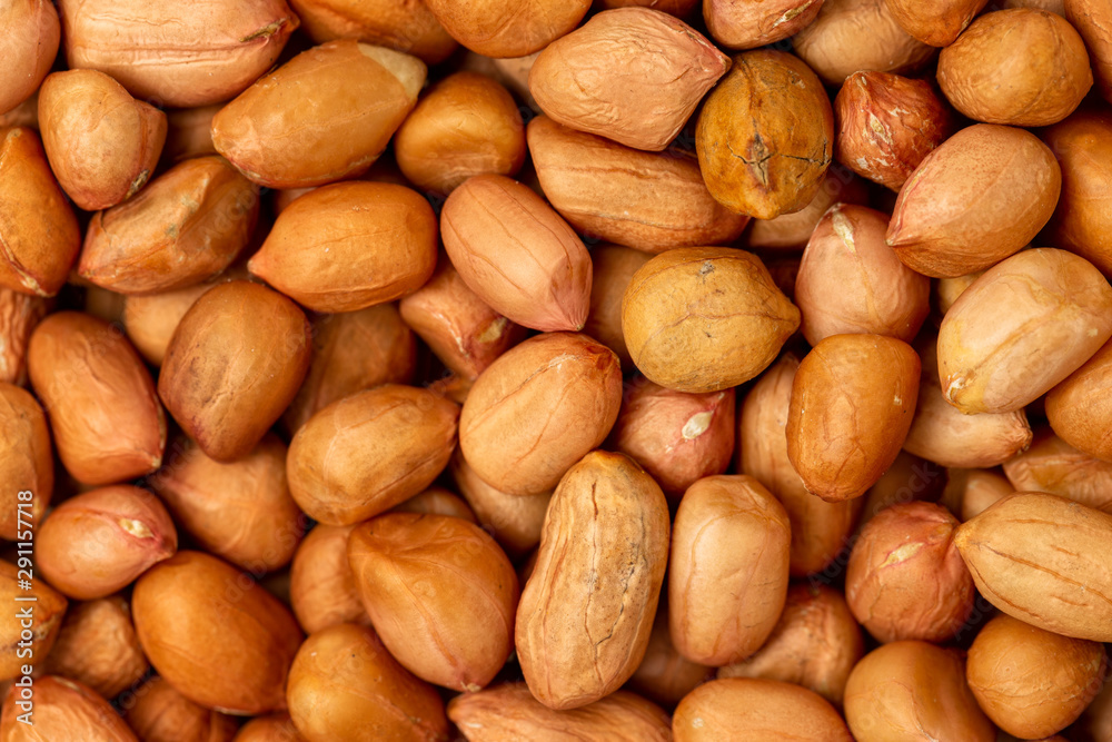 Macro top view image of roasted peanuts as a food background. Macro top view image of roasted peanuts as a food background.