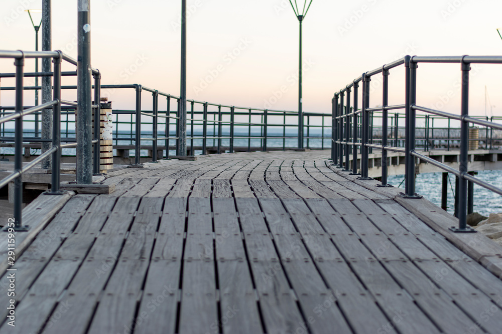 Pier on the seaside with lampposts Pier on the seaside with lampposts