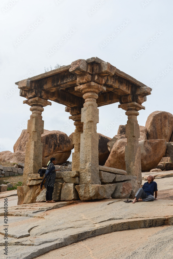 people looking at ancient structure of Hampi. people looking at ancient structure of Hampi.