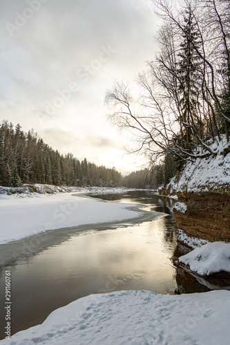 Fototapeta Naklejka Na Ścianę i Meble -  View to river Gauja and Sietiniezis rock on a winter day with snow and ice in Latvia