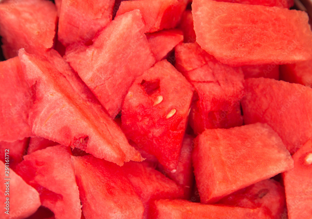 Close - up of a few pieces of refreshing ripe watermelon. Raw organic fruits vegetables. Useful product. Close - up of a few pieces of refreshing ripe watermelon. Raw organic fruits vegetables. Useful product.