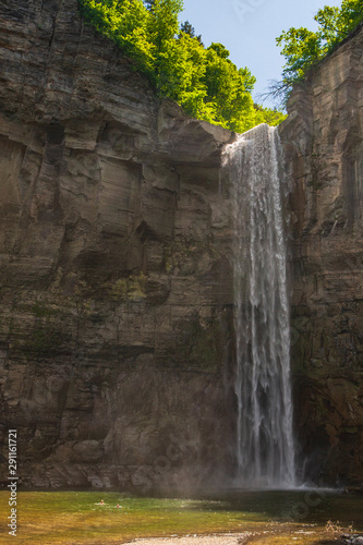 Taughannock Falls is a 215-foot  66 m  plunge waterfall  that is the highest single-drop waterfall east of the Rocky Mountains  located about 10 miles north of Ithaca in New York State  USA.