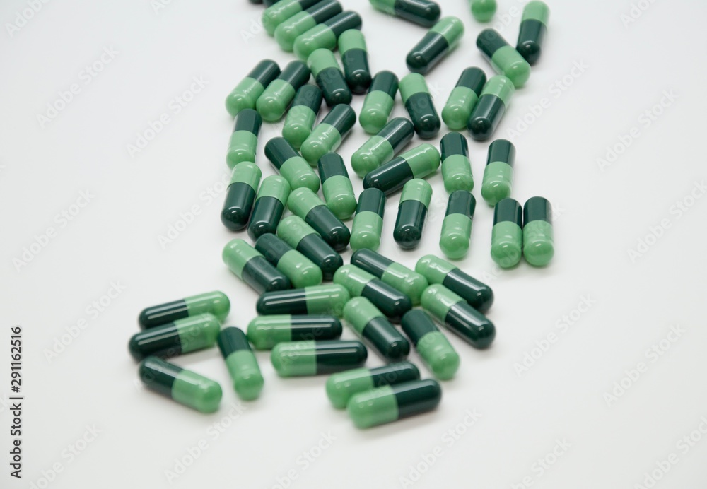 Green capsules in the pharmacy laboratory Green capsules in the pharmacy laboratory