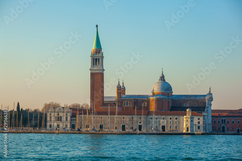 High bell tower and the Church of Saint George called San Giorgio Maggiore in Venice. Italy.