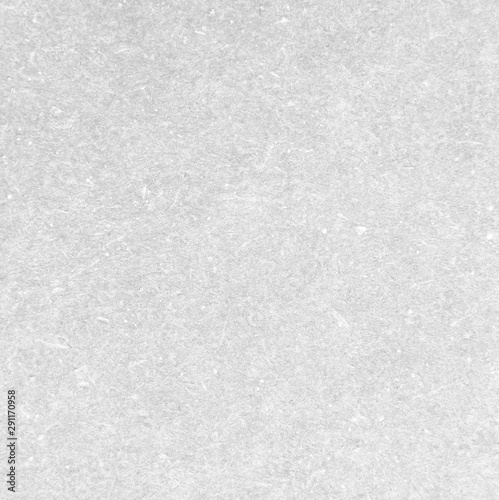 Abstract grey background of rough textured paper or cardboard surface.