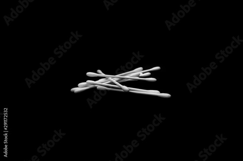 White and clean cotton buds with dark background textures
