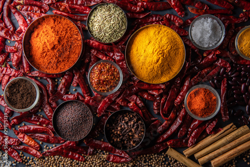 Fototapeta Naklejka Na Ścianę i Meble -  Variety of spices and herbs on kitchen table