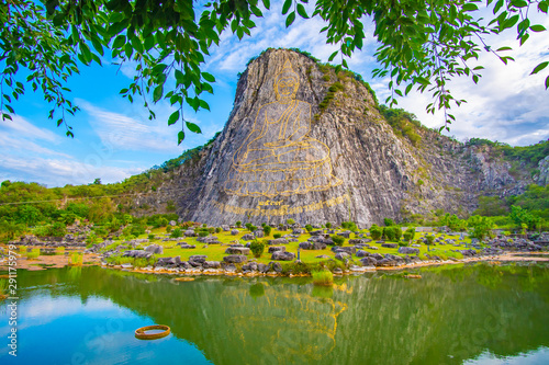 Big buddha with cloudy background at Khao Chi Chan Moutain, Pattaya. Chonburi, Thailand.Thai language,translate:created in 1996, buddha's name is Phra Puttha Maha Wachira Uttamopat Satsada.. photo