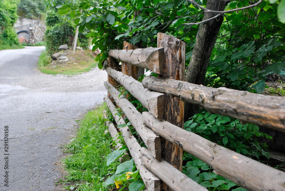 detail of a wooden fence in a mountain path detail of a wooden fence in a mountain path