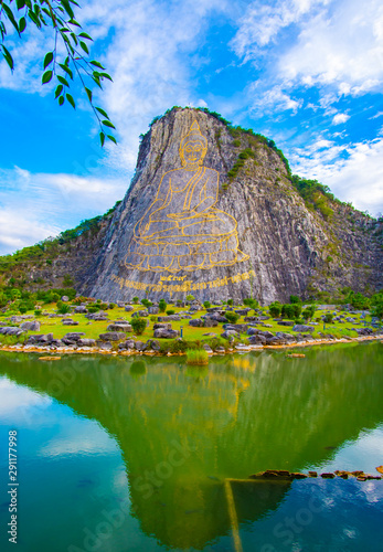 Big buddha with cloudy background at Khao Chi Chan Moutain, Pattaya. Chonburi, Thailand.Thai language,translate:created in 1996, buddha's name is Phra Puttha Maha Wachira Uttamopat Satsada.. photo