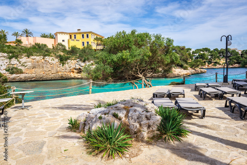 Promenade along Cala Ferrera beach, a popular family destination in the south-east of Mallorca. Spain photo