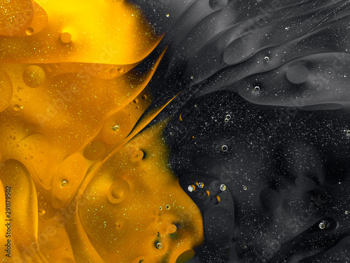 Colourful surreal psychedelic abstract liquid background. Water and oil drops with small air bubbles photo