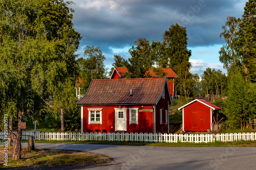 View of small, red Swedish houses in the swedish village Herräng, near by the east coast northern Stockholm © Margit Kluthke