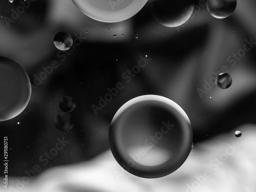 Monochrome surreal psychedelic abstract liquid background. Water and oil drops with small air bubbles photo