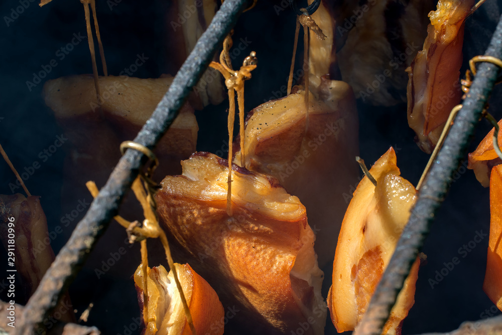 The meat is smoked in the smoke in the smokehouse. The meat is smoked in the smoke in the smokehouse.