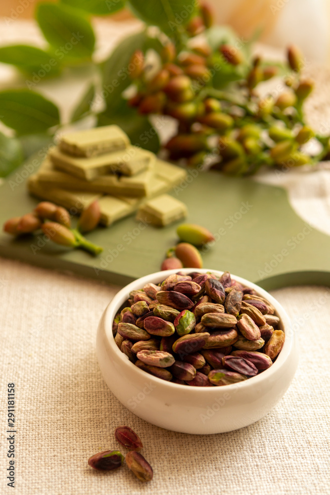 Sweet, delicate and fragrant nuts, Bronte pistachios with brilliant green colour, ingredient for Italian cuisine, ice creams, cakes, pesto Sweet, delicate and fragrant nuts, Bronte pistachios with brilliant green colour, ingredient for Italian cuisine, ice creams, cakes, pesto