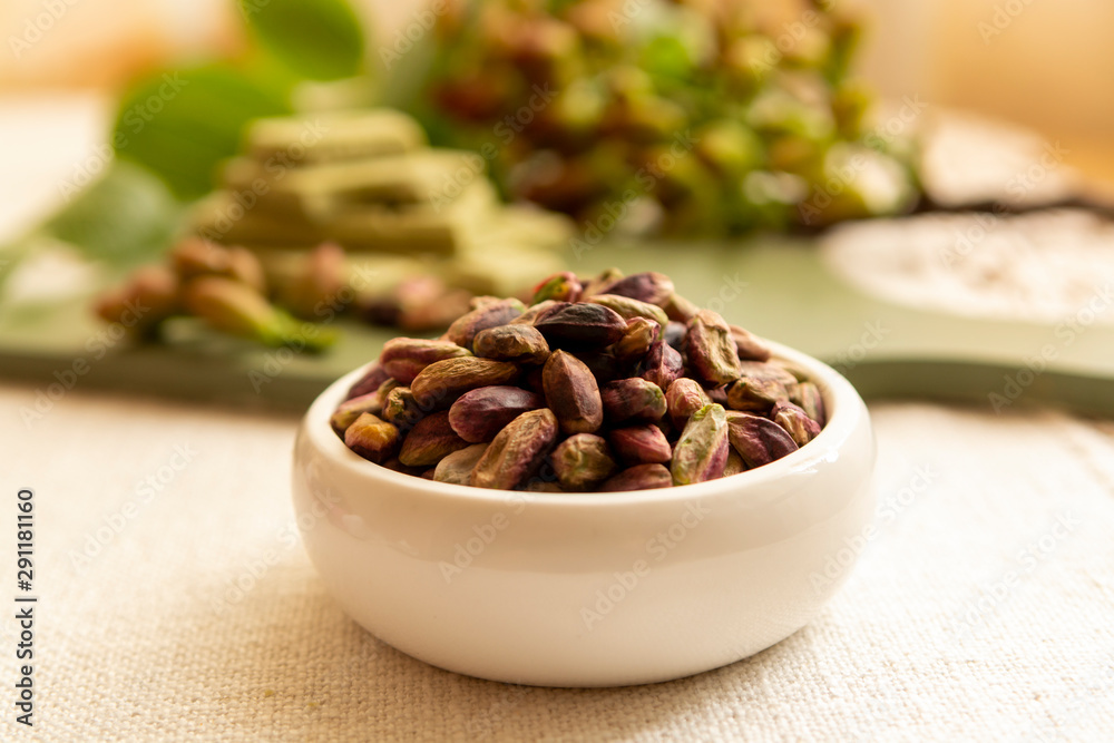 Sweet, delicate and fragrant nuts, Bronte pistachios with brilliant green colour, ingredient for Italian cuisine, ice creams, cakes, pesto Sweet, delicate and fragrant nuts, Bronte pistachios with brilliant green colour, ingredient for Italian cuisine, ice creams, cakes, pesto